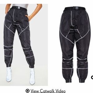 Light reflective parachute joggers